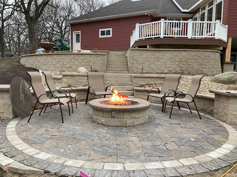 Fire pit at lake home with retaining wall.