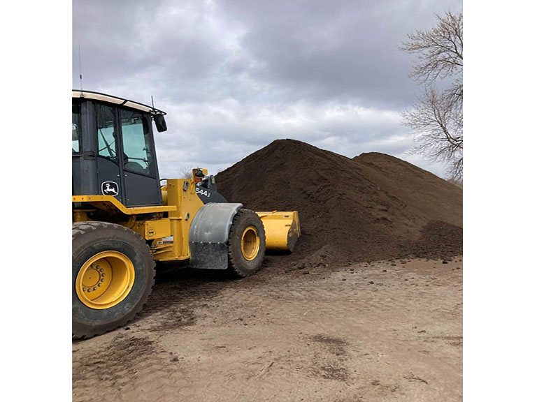 Outdoor Renovations moving giant pile of dirt