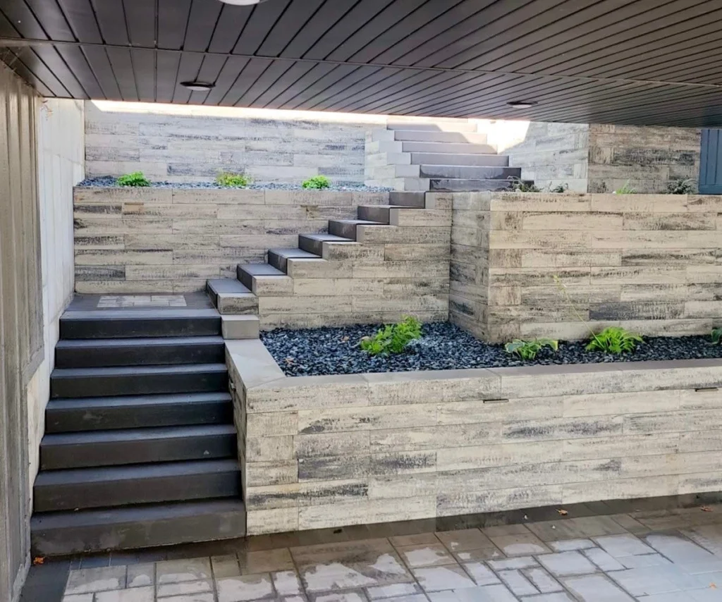 two tiered stairs with a rock covered flower bed